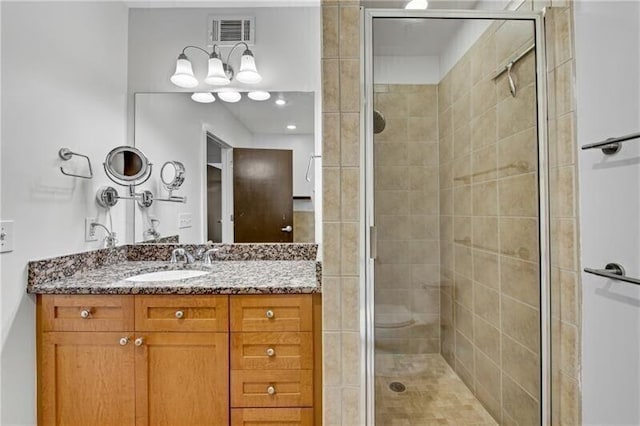 bathroom with vanity and an enclosed shower