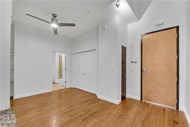 unfurnished bedroom with light hardwood / wood-style flooring and ceiling fan