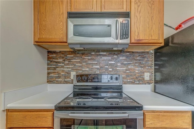 3623 Thurleston Ct SW, Marietta, GA 30008 - kitchen with stainless steel appliances, light countertops, and decorative backsplash