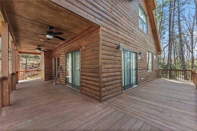 wooden deck with a ceiling fan