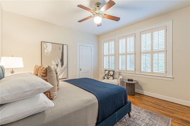 1015 Piedmont Ave NE Unit A2, Atlanta, GA 30309 - bedroom featuring baseboards, ceiling fan, and wood finished floors