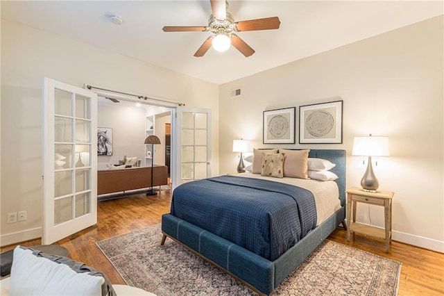 1015 Piedmont Ave NE Unit A2, Atlanta, GA 30309 - bedroom with baseboards, visible vents, wood finished floors, and a ceiling fan