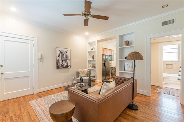1015 Piedmont Ave NE Unit A2, Atlanta, GA 30309 - office featuring visible vents, crown molding, baseboards, ceiling fan, and light wood-style floors