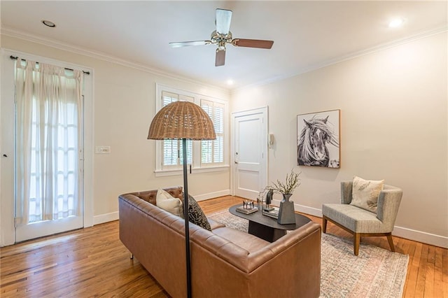 1015 Piedmont Ave NE Unit A2, Atlanta, GA 30309 - living area with crown molding, light wood-style floors, ceiling fan, and baseboards