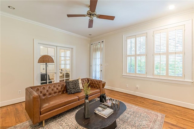 1015 Piedmont Ave NE Unit A2, Atlanta, GA 30309 - living room featuring baseboards, ornamental molding, wood finished floors, and a ceiling fan