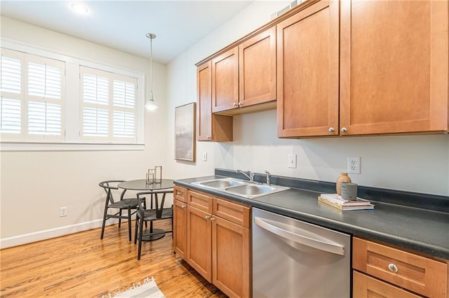 1015 Piedmont Ave NE Unit A2, Atlanta, GA 30309 - kitchen featuring light wood-type flooring, a sink, dark countertops, and stainless steel dishwasher