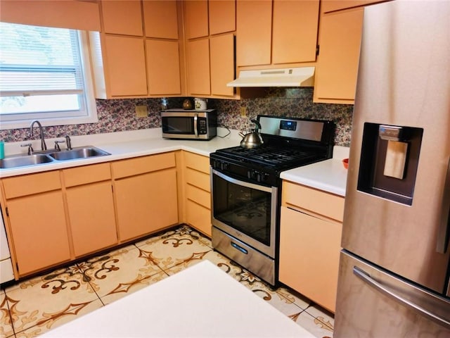 kitchen featuring stainless steel appliances, backsplash, sink, and light tile floors