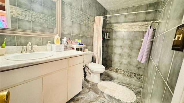 bathroom featuring tile walls, a shower with shower curtain, tile floors, toilet, and vanity