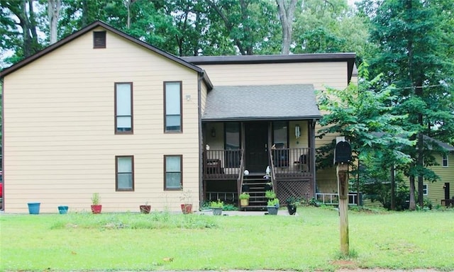 tri-level home with a front lawn