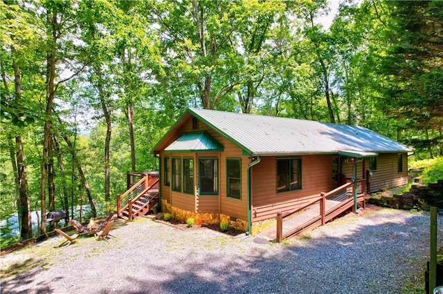 307 Pigeon Creek Rd, Blue Ridge, GA 30513 - rustic home with a metal roof and a deck