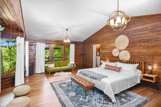 307 Pigeon Creek Rd, Blue Ridge, GA 30513 - bedroom with a chandelier, wood walls, wood finished floors, and high vaulted ceiling