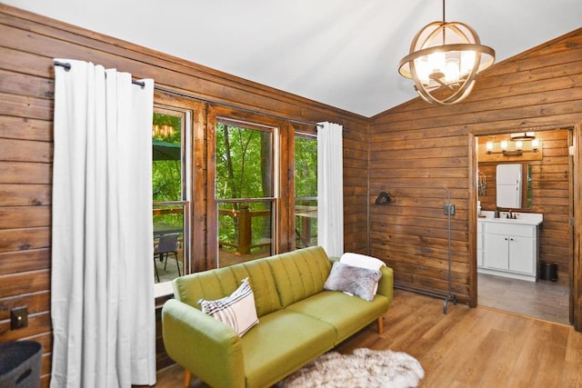 307 Pigeon Creek Rd, Blue Ridge, GA 30513 - sitting room with lofted ceiling, a chandelier, wood finished floors, and wooden walls