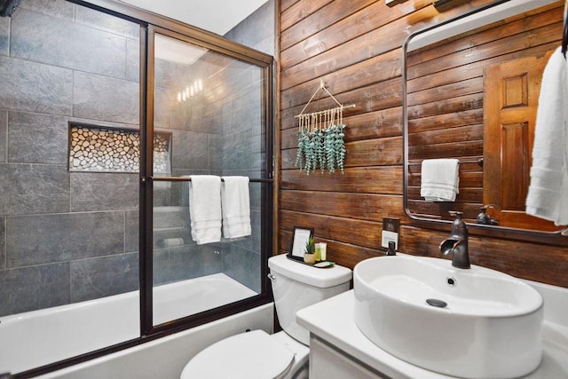 307 Pigeon Creek Rd, Blue Ridge, GA 30513 - bathroom featuring wooden walls, enclosed tub / shower combo, and vanity