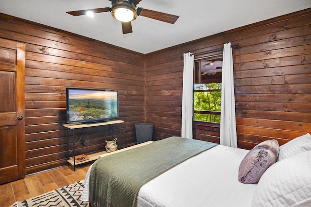 307 Pigeon Creek Rd, Blue Ridge, GA 30513 - bedroom featuring wooden walls, wood finished floors, crown molding, and ceiling fan