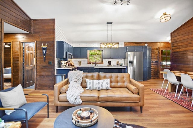 307 Pigeon Creek Rd, Blue Ridge, GA 30513 - living room with wood walls and light wood-style floors