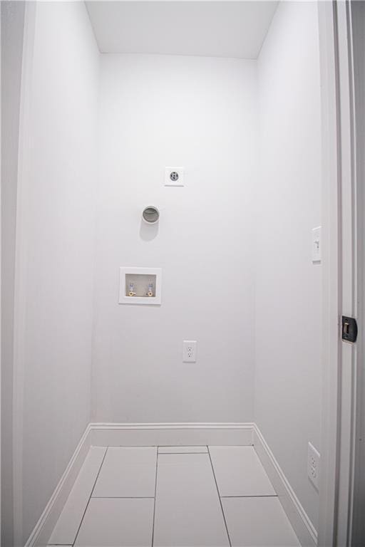 laundry area with electric dryer hookup, washer hookup, and tile patterned flooring