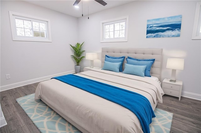 bedroom featuring ceiling fan and dark hardwood / wood-style flooring