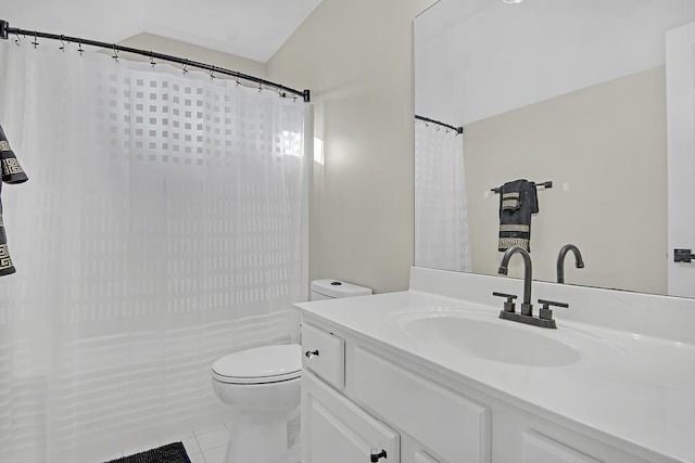 bathroom with tile patterned floors, vanity, and toilet