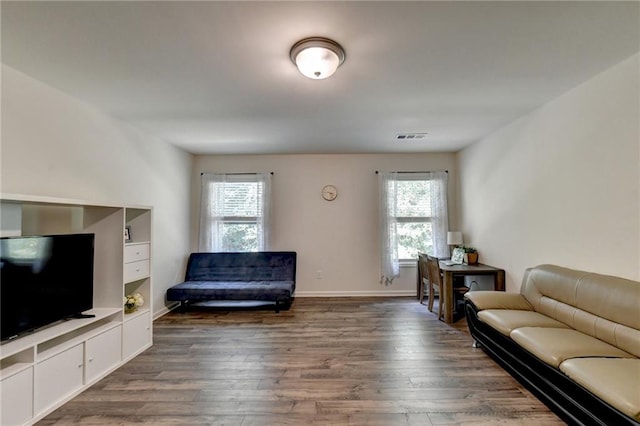 living room with dark hardwood / wood-style floors