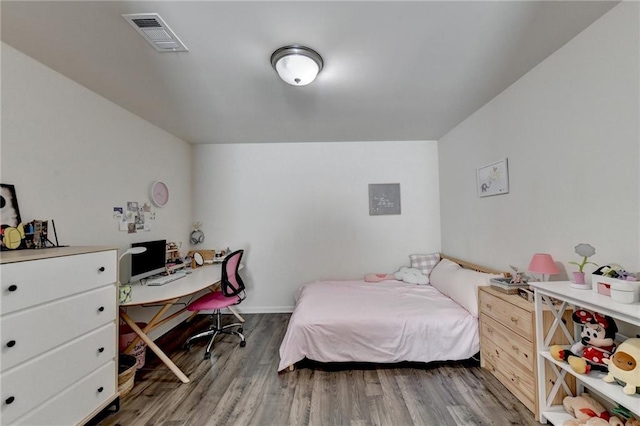 bedroom featuring hardwood / wood-style floors