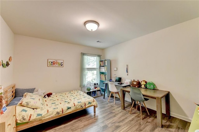 bedroom featuring hardwood / wood-style flooring