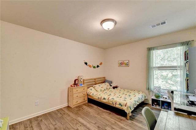 bedroom with light hardwood / wood-style floors