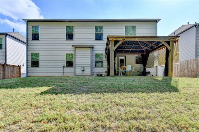 back of house featuring a yard