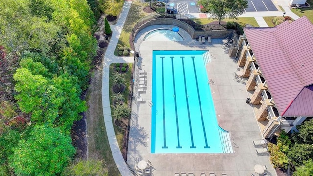 view of swimming pool featuring a patio