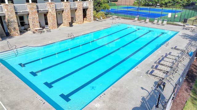 view of pool featuring a patio area