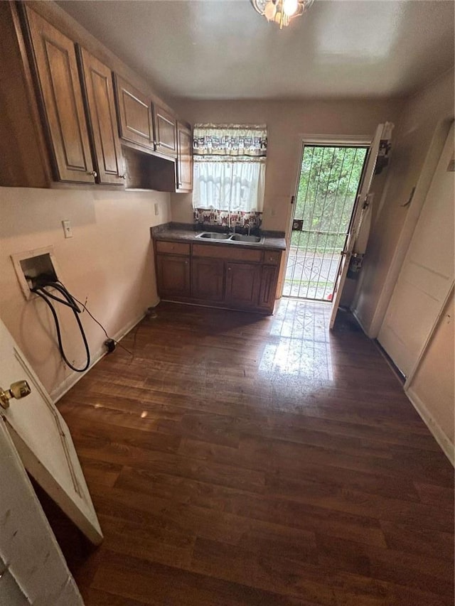 kitchen with dark wood-type flooring and sink