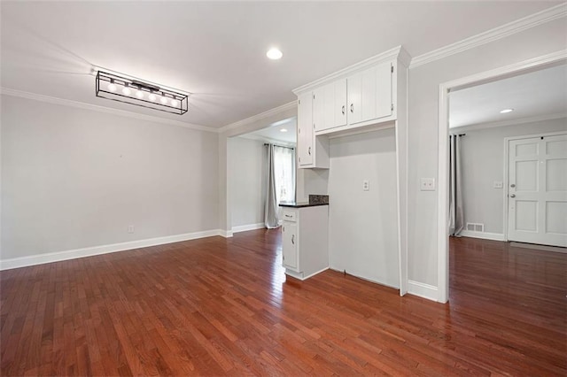 2880 Brett Cir NW, Acworth, GA 30101 - kitchen featuring crown molding, white cabinets, dark countertops, dark wood-style flooring, and recessed lighting