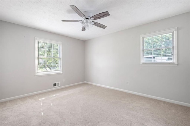 2880 Brett Cir NW, Acworth, GA 30101 - unfurnished room with light carpet, a ceiling fan, and a textured ceiling