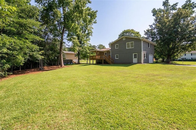 2880 Brett Cir NW, Acworth, GA 30101 - view of green lawn with stairs, a garage, and a deck