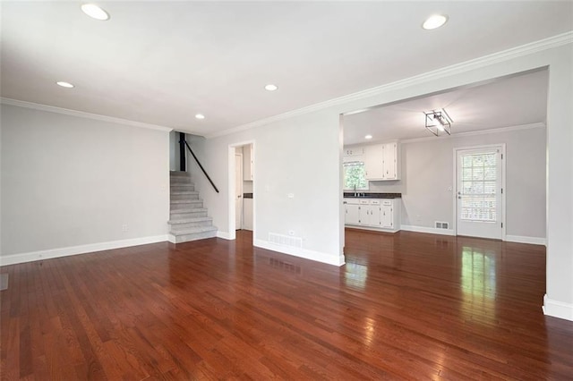 2880 Brett Cir NW, Acworth, GA 30101 - unfurnished living room featuring recessed lighting, stairway, ornamental molding, and dark wood-type flooring