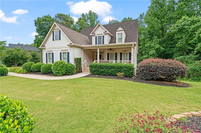 4915 Lazy Creek Ct, Cumming, GA 30028 - view of front of property featuring ceiling fan, board and batten siding, a porch, and a front lawn