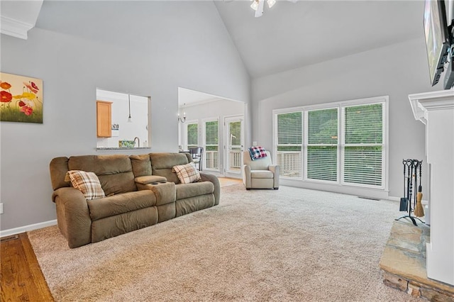 4915 Lazy Creek Ct, Cumming, GA 30028 - living area with high vaulted ceiling, baseboards, wood finished floors, a ceiling fan, and a chandelier