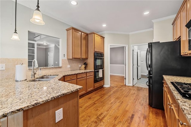 4915 Lazy Creek Ct, Cumming, GA 30028 - kitchen with a sink, black appliances, tasteful backsplash, light stone countertops, and crown molding