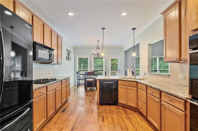 4915 Lazy Creek Ct, Cumming, GA 30028 - kitchen with black appliances, a sink, a chandelier, recessed lighting, and ornamental molding