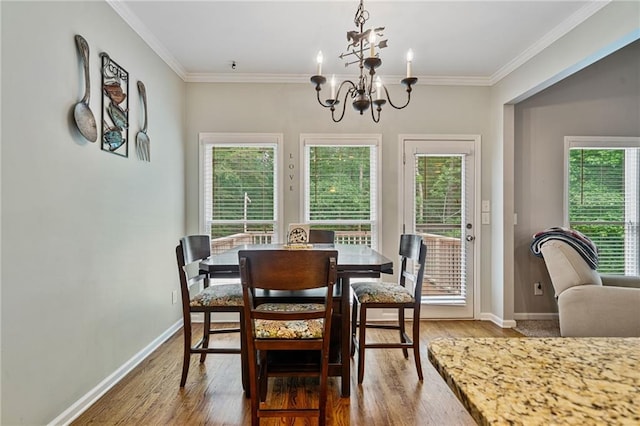 4915 Lazy Creek Ct, Cumming, GA 30028 - dining area with a chandelier, wood finished floors, baseboards, and ornamental molding