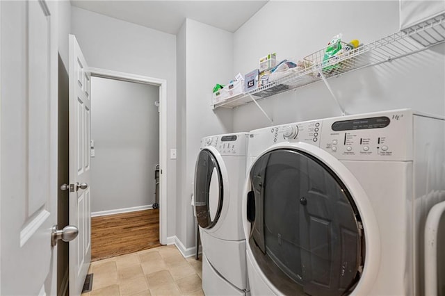 4915 Lazy Creek Ct, Cumming, GA 30028 - laundry room featuring independent washer and dryer and baseboards