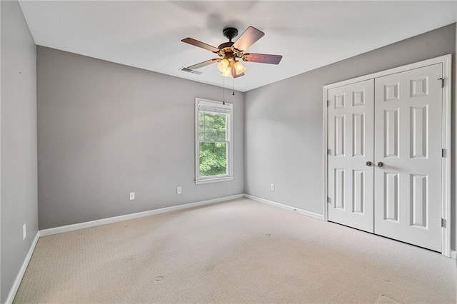 4915 Lazy Creek Ct, Cumming, GA 30028 - unfurnished bedroom featuring baseboards, carpet flooring, a closet, and a ceiling fan