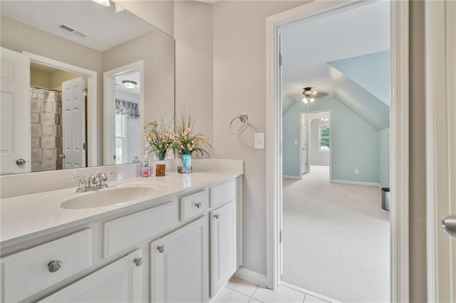 4915 Lazy Creek Ct, Cumming, GA 30028 - full bath with vanity, baseboards, vaulted ceiling, a ceiling fan, and tile patterned flooring