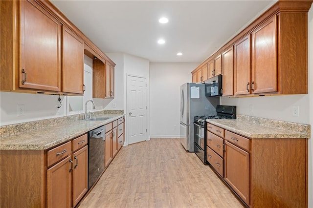 4915 Lazy Creek Ct, Cumming, GA 30028 - kitchen featuring gas range oven, dishwasher, a sink, light wood-style flooring, and recessed lighting
