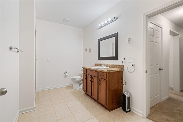 4915 Lazy Creek Ct, Cumming, GA 30028 - bathroom with vanity, toilet, tile patterned floors, and baseboards