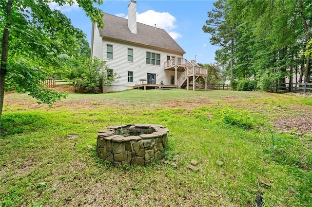 4915 Lazy Creek Ct, Cumming, GA 30028 - back of property featuring an outdoor fire pit, stairway, a deck, and a chimney