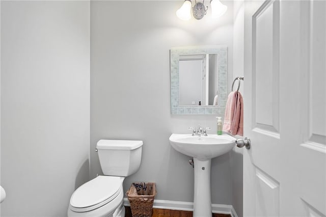 4915 Lazy Creek Ct, Cumming, GA 30028 - half bath featuring toilet, wood finished floors, and baseboards