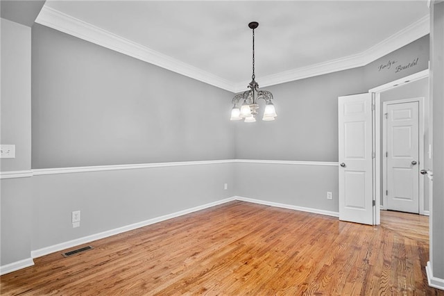 4915 Lazy Creek Ct, Cumming, GA 30028 - spare room featuring ornamental molding, a chandelier, wood finished floors, and baseboards