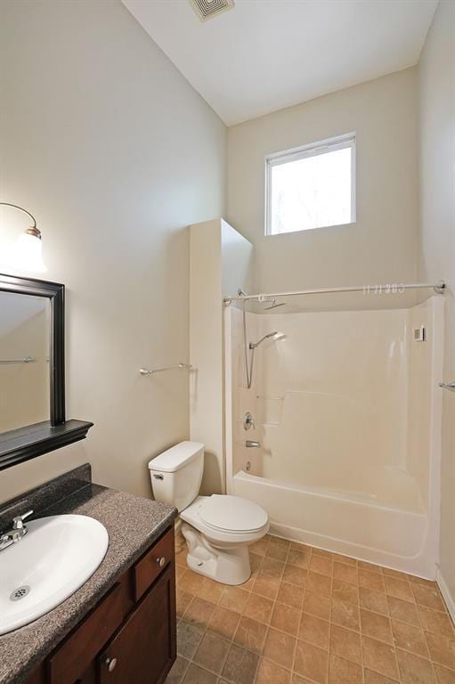 bathroom featuring visible vents, shower / bathing tub combination, vanity, and toilet