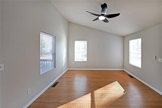 unfurnished room with baseboards, visible vents, and light wood finished floors