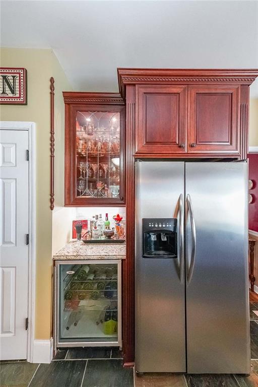 12 Blackfoot Trl, Sharpsburg, GA 30277 - indoor dry bar with stainless steel refrigerator with ice dispenser and wine cooler